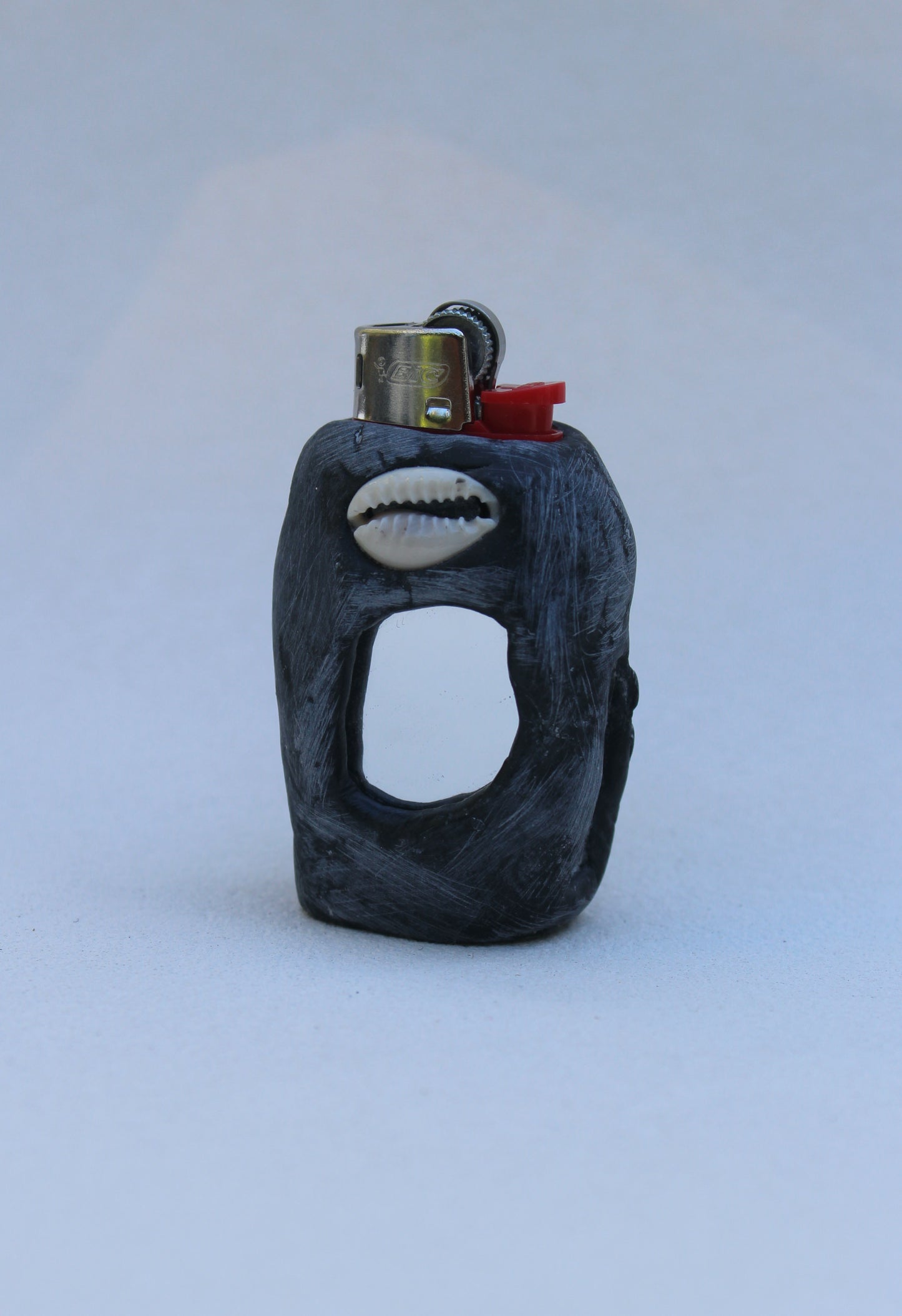 Cowry shell staring back at you mini