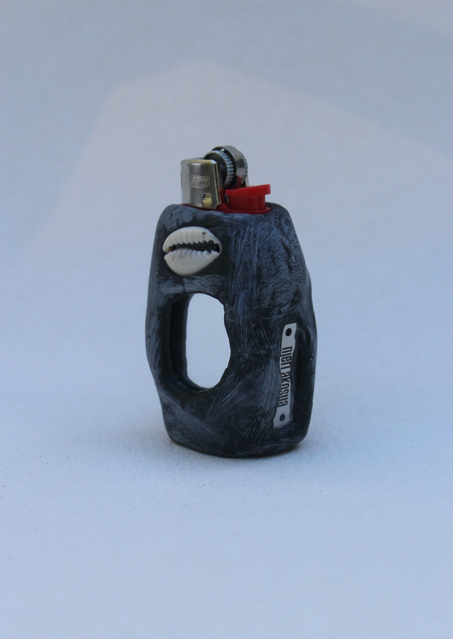 Cowry shell staring back at you mini